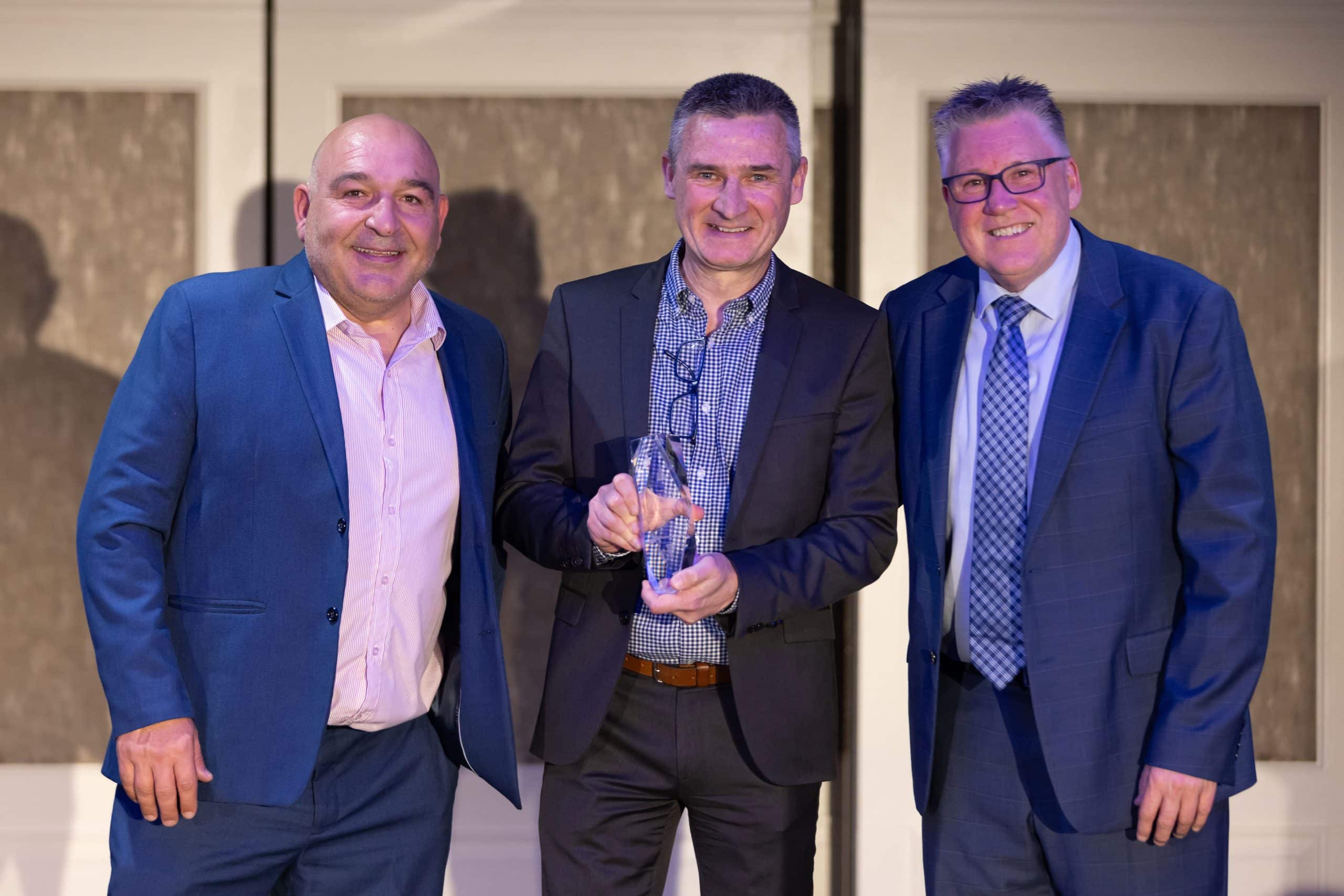 Steve Whitford and Nik accepting Natalie Allsop’s 2025 Emerging Leader of the Year award at the Parking Industry Awards